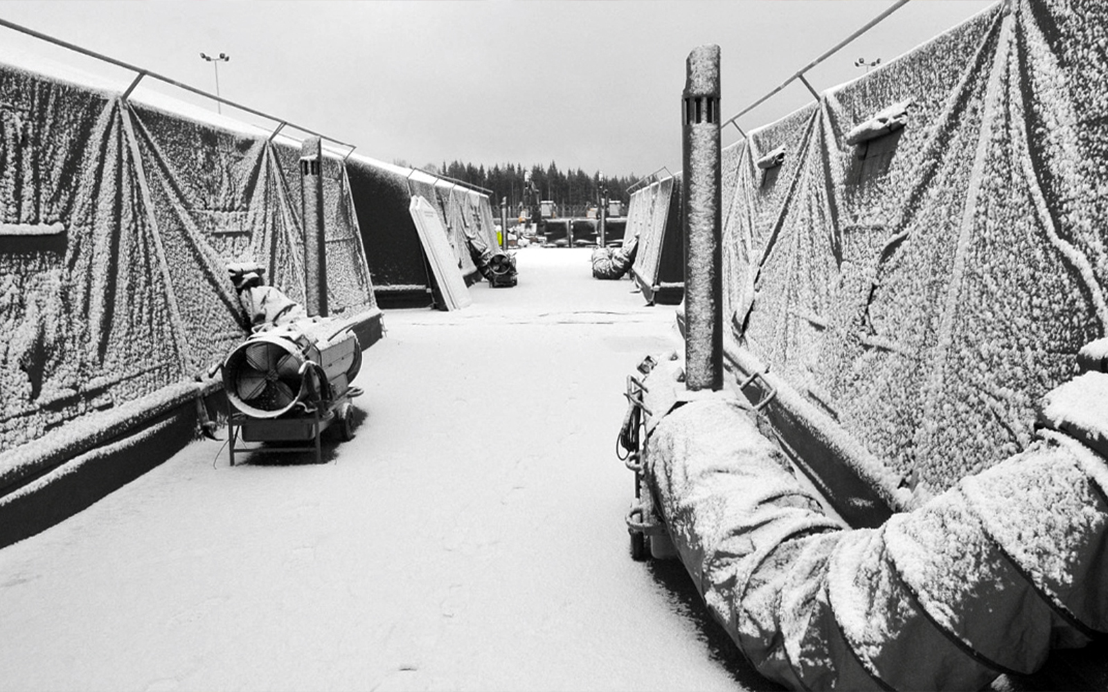 Army tents covered in snow with ITA heating.